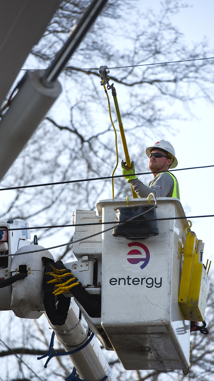 Crews work to restore power in Elliott, Mississippi, following severe weather on Saturday.